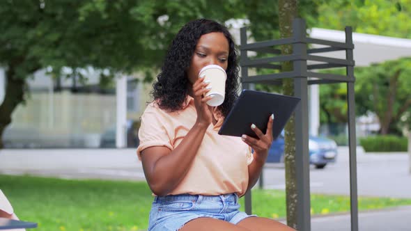 Student Girl with Tablet Pc and Drinking Coffee