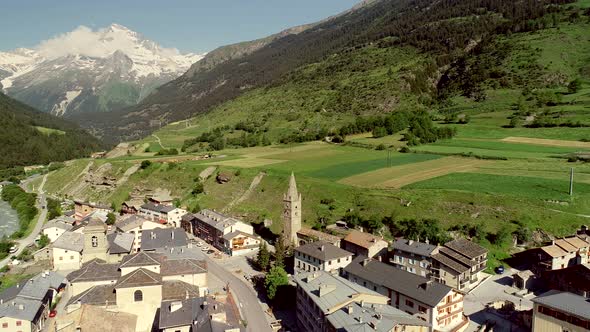 Aerial view of Lanslebourg village and snow peak mountain, Savoie, France.