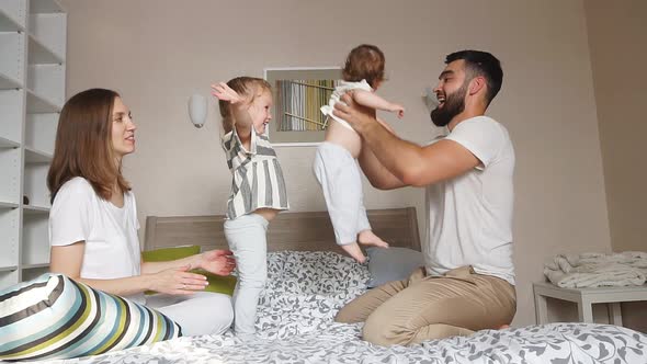 Young Parents Enjoying Weekend with Children