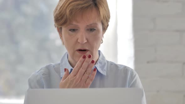 Shocked Stunned Old Woman Wondering and Working on Laptop