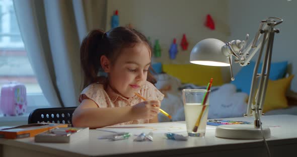 Little Girl Learns to Draw an Artistic Picture