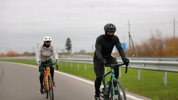 Two Cyclists are Training on the Track