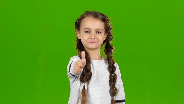 Baby Girl Shows Thumbs Up. Green Screen