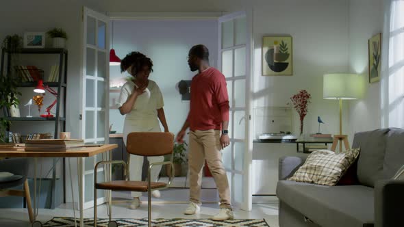 Unhappy Family Couple Having Quarrel in Living Room