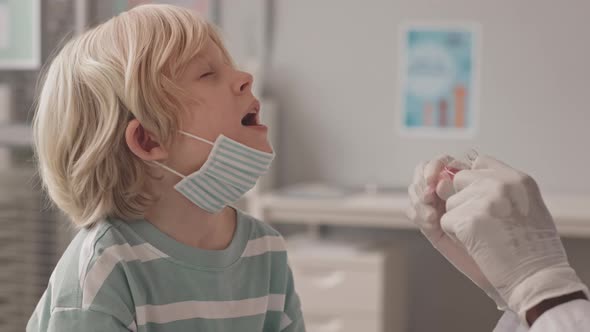 Doctor Giving Oral Vaccine to Little Boy