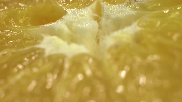 Very Close Footage of Mid Cut Orange. Concept of Making Orange Juice.