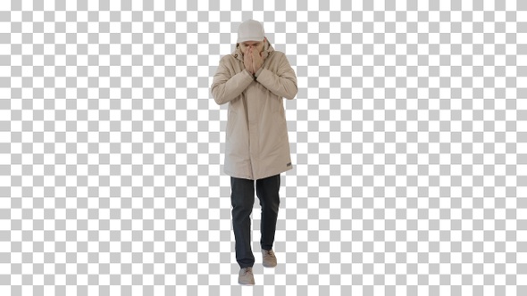 Man in winter outfit walking and coughing, Alpha Channel