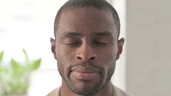 Close Up of African Man Looking at the Camera