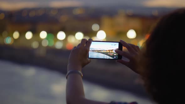 A Woman Is Taking Pictures of the Embankment on Her Mobile Phone. , FHD