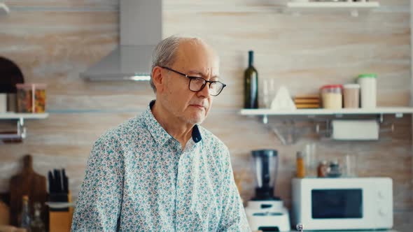 Mature Man Looking at Camera