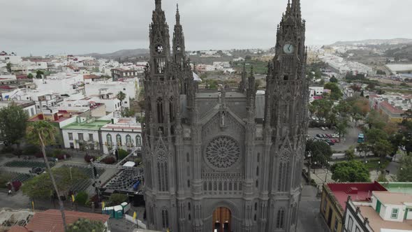 Aerial shot of gray gothic architecture church in Aruca, Gran Canaria, Spain