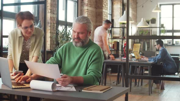 Time Lapse of Mature Businessman Working in Office