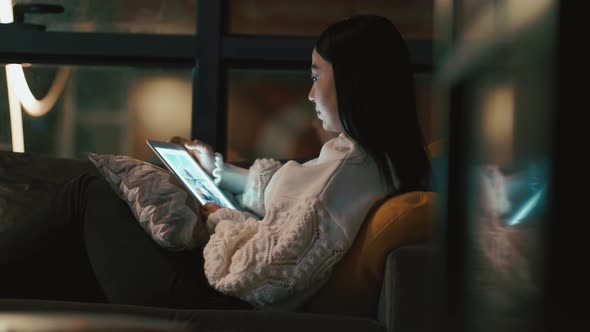 Woman Watching Video From Tablet