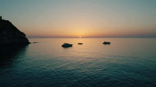 Silhouette of the Promontory of Tropea at Sunset in Summer