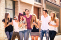 Group of young best friends having fun together walking on town street - PhotoDune Item for Sale