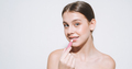 Beauty portrait of girl with fresh skin, teenager doing lips makeup on white background, banner - PhotoDune Item for Sale