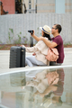 Multiracial couple of tourists taking photos in city together. - PhotoDune Item for Sale