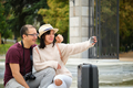 Multiracial couple of tourists taking a selfie together. - PhotoDune Item for Sale
