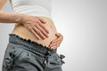 Young pregnant woman cradling her belly - PhotoDune Item for Sale