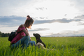 Young woman in a meadow with her two dogs - PhotoDune Item for Sale