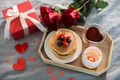 Valentine's day breakfast concept. Pancakes with berries, roses flowers, cup of tea - PhotoDune Item for Sale