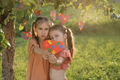 Sad preoccupied with problem of autism girls show heart-shaped card with puzzles - PhotoDune Item for Sale