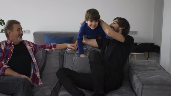 Portrait of Happy Caucasian Three Generation Men Smiling Having Fun Together at Home