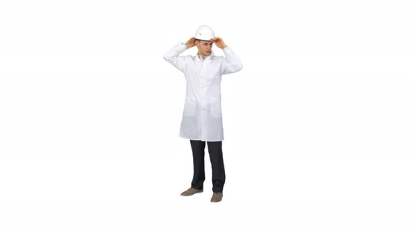 Dancing Young Engineer with Helmet After Work on White Background