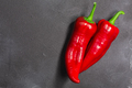 Paprika chile peppers atop dark concrete backdrop, top view, copy space. Capsicum annuum fruits - PhotoDune Item for Sale