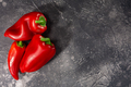Paprika bell peppers atop dark concrete backdrop, top view, copy space. Capsicum annuum fruits - PhotoDune Item for Sale