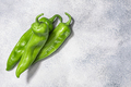 Hatch green chile peppers atop light grey backdrop, top view, copy space - PhotoDune Item for Sale