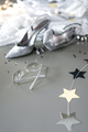 Formal evening wear silver high heels and glittery dress laying on the grey background. - PhotoDune Item for Sale