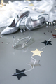 Formal evening wear silver high heels and glittery dress laying on the grey background. - PhotoDune Item for Sale