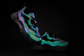 Pair of styled neon glowing sneakers on black background - PhotoDune Item for Sale
