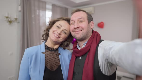 Smartphone Camera POV of Smiling Loving Adult Couple Taking Selfie