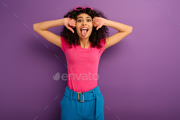 looking at camera on purple background