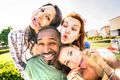Happy multiracial friends group taking selfie sticking tongue out with funny faces - PhotoDune Item for Sale