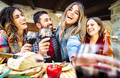 Young people having fun drinking wine out side at farm house bar patio - PhotoDune Item for Sale