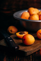Mellow apricots with knife over cutting board - PhotoDune Item for Sale