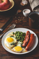 Breakfast with fried eggs, sausages and green peas - PhotoDune Item for Sale