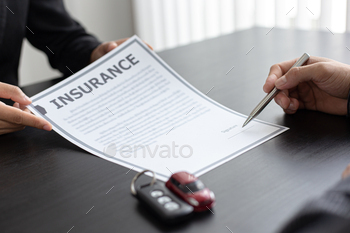 cuments and car sales agreements with insurance. Document signing and credit approval Concept.