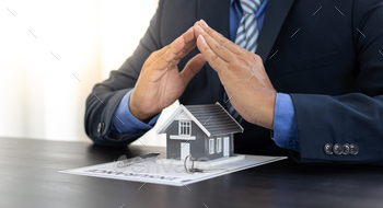 d over the keys and the house together with the insurance to the customer, Attention to property services and insurance concept.