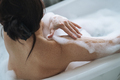 Crop photo of self loving adult brunette woman taking bath with foam at home - PhotoDune Item for Sale