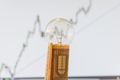 Bulb with euro banknotes beside it. Increase in energy tariffs. Efficiency and energy saving. - PhotoDune Item for Sale