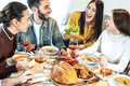 Group of smiling friends enjoying dinner at home - PhotoDune Item for Sale