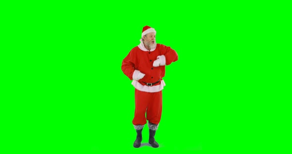 Santa claus dancing against green background 4k