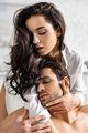 Sexy woman in white shirt hugging man with closed eyes - PhotoDune Item for Sale