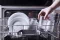 Open dishwasher with clean cutlery, glasses, dishes inside in the home kitchen - PhotoDune Item for Sale