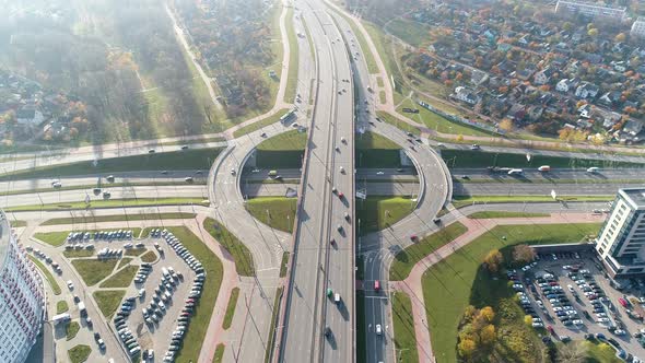 Traffic Interchange in European Metropolis, Cars and Trucks Drive Along the Road