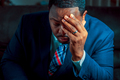 Black or African American business man sitting down looking anxious and depressed - PhotoDune Item for Sale